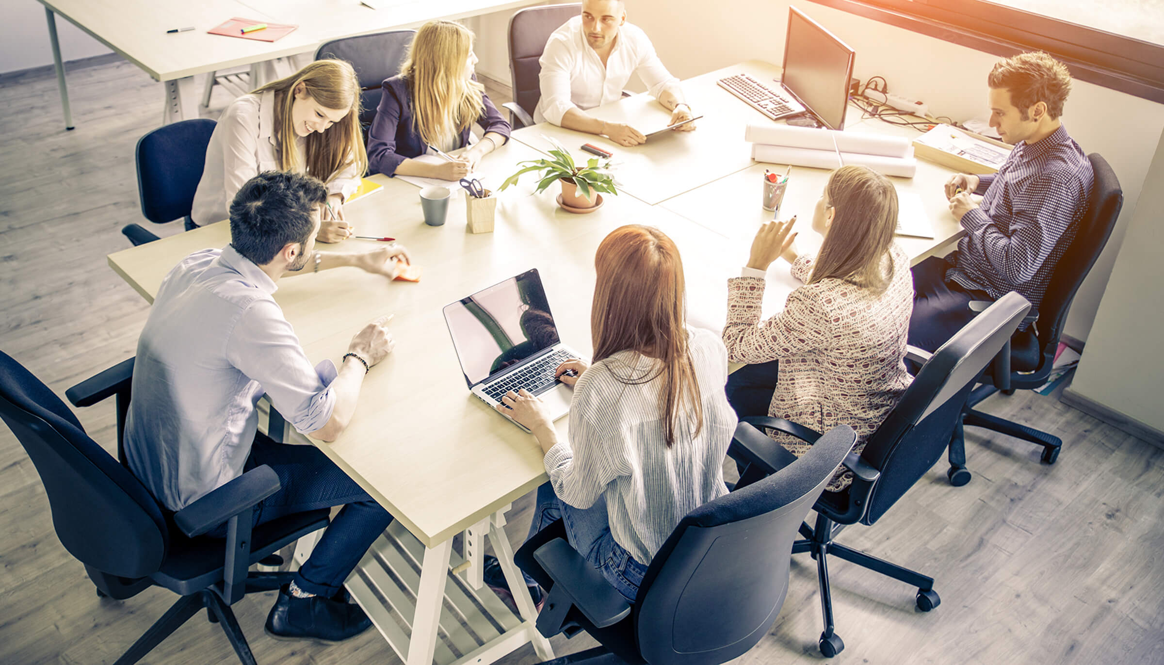 team discussing at a conference room table