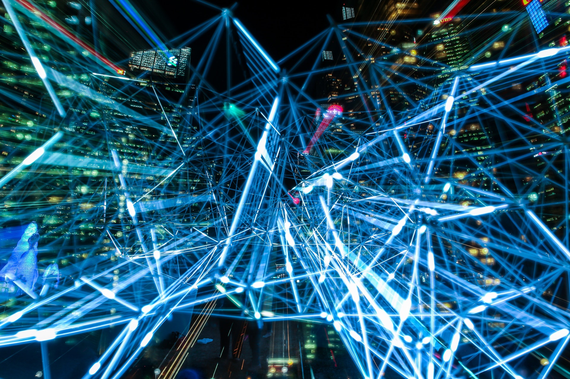 blue intersecting lines over a city at night