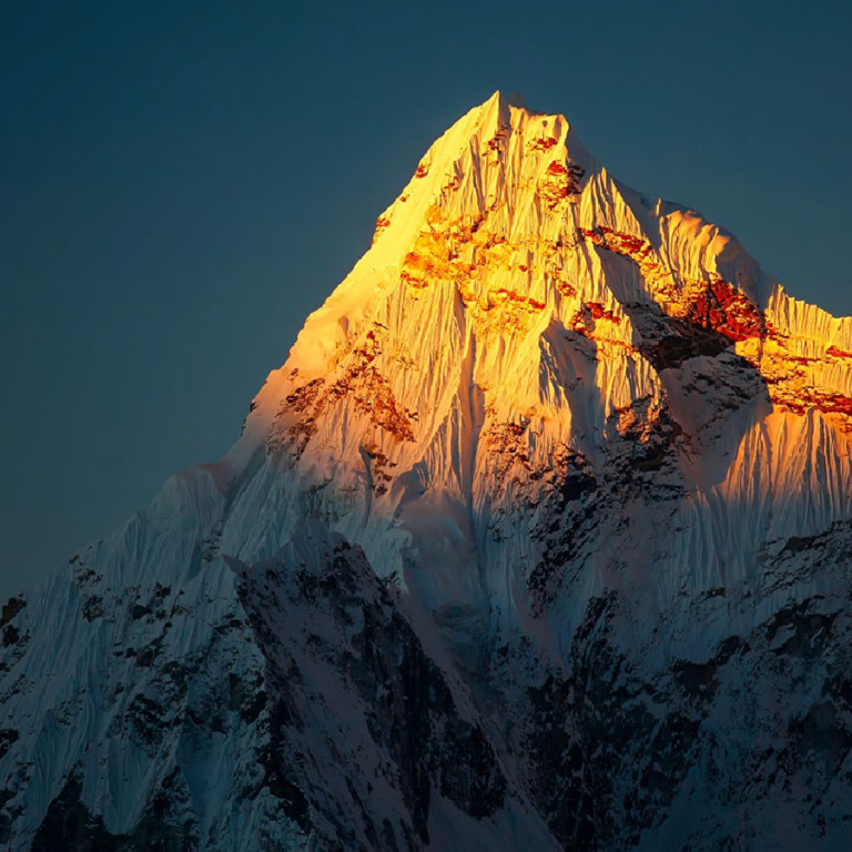 image on a mountain peak in the sun