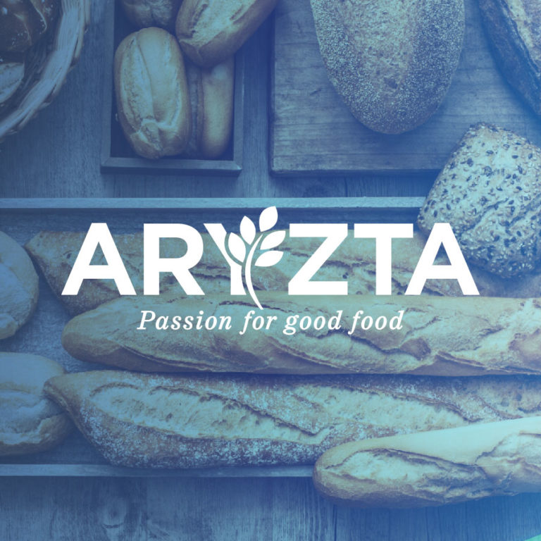 aryzta passion for good food logo over fresh baked breads
